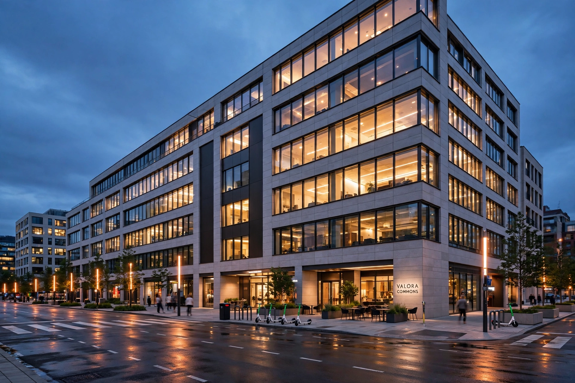 Commercial building at dusk with lit windows